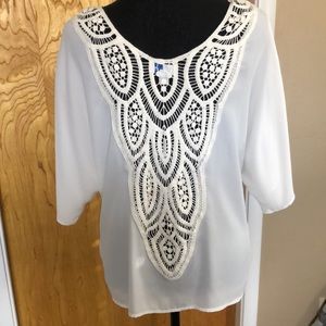 Button up blouse. Crochet/lace detail on back. Ties at waist.